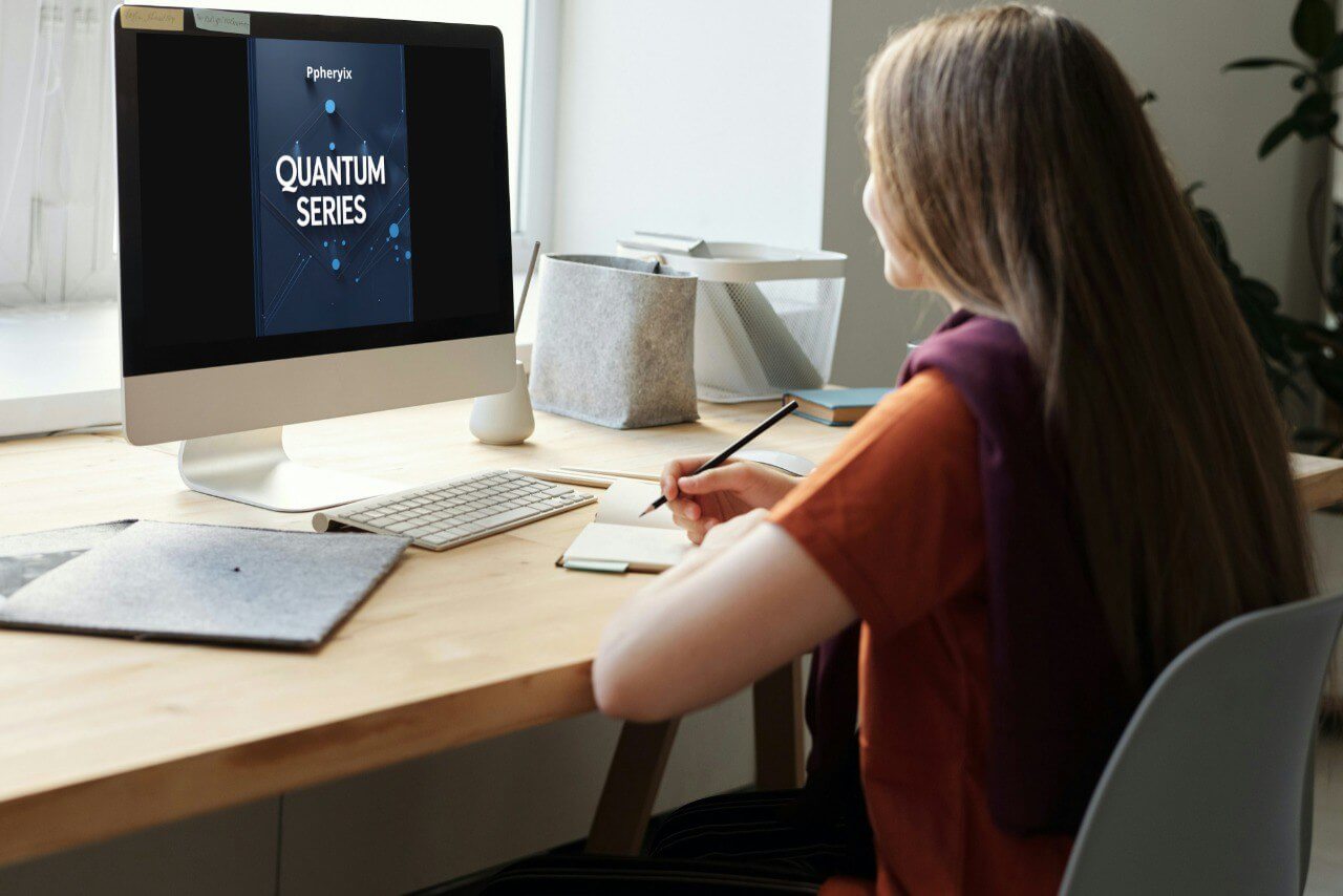 Person sitting at a desk with a computer displaying 'Pyrolysis Quantum Series' in a bright room.