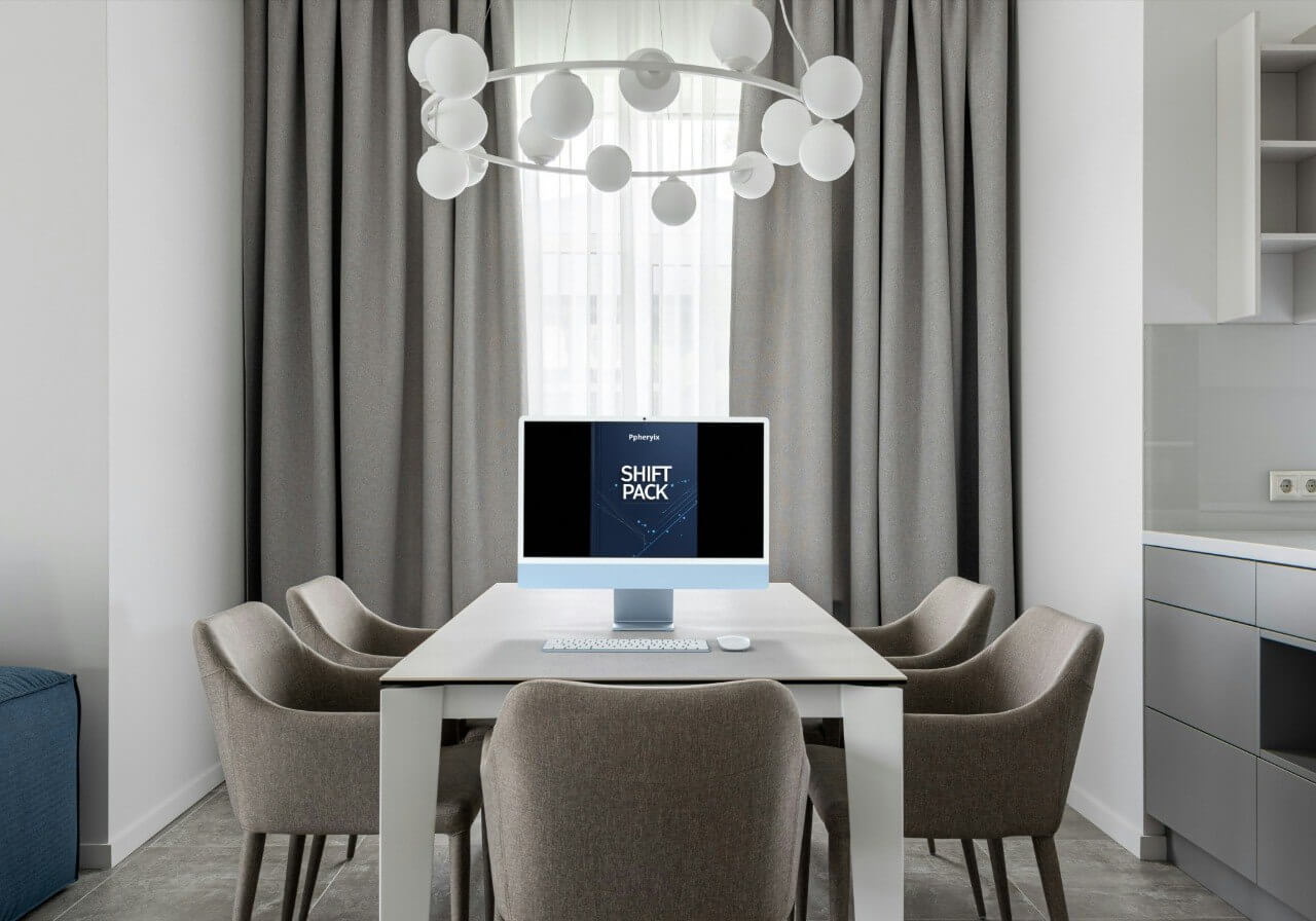 Modern dining area with a computer digital course "Shift Pack" setup on a table, surrounded by chairs.