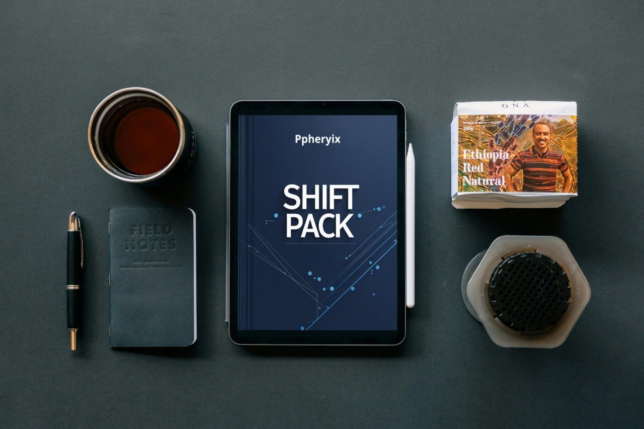 Tablet displaying 'Pheriyx Shift Pack' on a dark surface with coffee, notebook, and coffee bag.